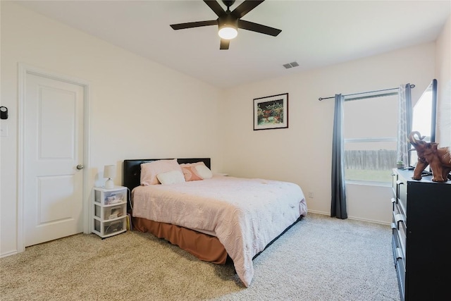 504 N Thunderstorm Ave, Lockhart, TX 78644 - bedroom featuring light colored carpet and ceiling fan