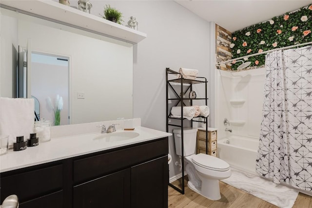 504 N Thunderstorm Ave, Lockhart, TX 78644 - full bath featuring vanity, wood finished floors, and shower / bath combination with curtain