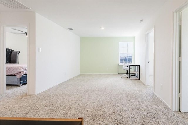 504 N Thunderstorm Ave, Lockhart, TX 78644 - carpeted spare room with a smoke detector and baseboards