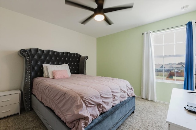 504 N Thunderstorm Ave, Lockhart, TX 78644 - carpeted bedroom with baseboards and a ceiling fan