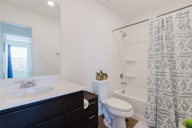 504 N Thunderstorm Ave, Lockhart, TX 78644 - bathroom featuring vanity, shower / bath combo with shower curtain, and wood finished floors