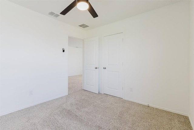504 N Thunderstorm Ave, Lockhart, TX 78644 - unfurnished bedroom featuring light carpet, a ceiling fan, and a closet