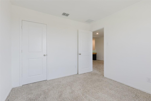 504 N Thunderstorm Ave, Lockhart, TX 78644 - unfurnished bedroom with carpet flooring and recessed lighting