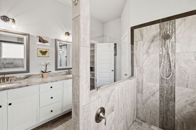 4 Country Ct, Wimberley, TX 78676 - bathroom featuring a walk in shower and double vanity