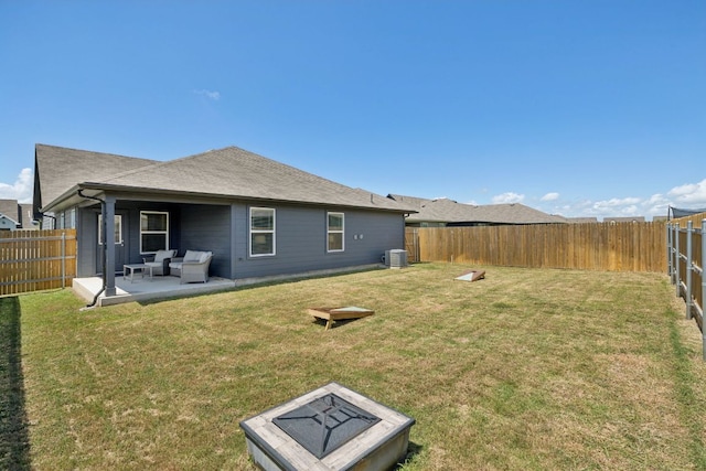 1004 Norway, Seguin, TX 78155 - rear view of house featuring a fenced backyard, an outdoor living space with a fire pit, and a patio