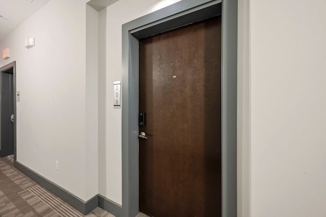 1320 Robert Browning St Unit 208, Austin, TX 78723 - hallway with elevator and baseboards