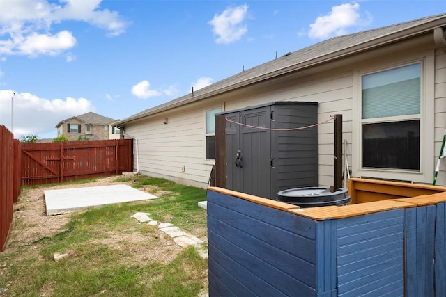 296 Blooming Trl, Kyle, TX 78640 - view of yard featuring a patio area and a storage shed