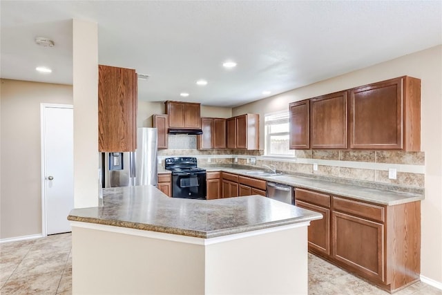 9104 Single Bend Trl, Temple, TX 76502 - kitchen with stainless steel appliances, decorative backsplash, under cabinet range hood, recessed lighting, and brown cabinetry