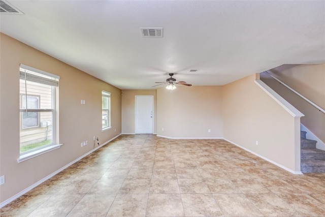 9104 Single Bend Trl, Temple, TX 76502 - unfurnished living room with a ceiling fan and stairway
