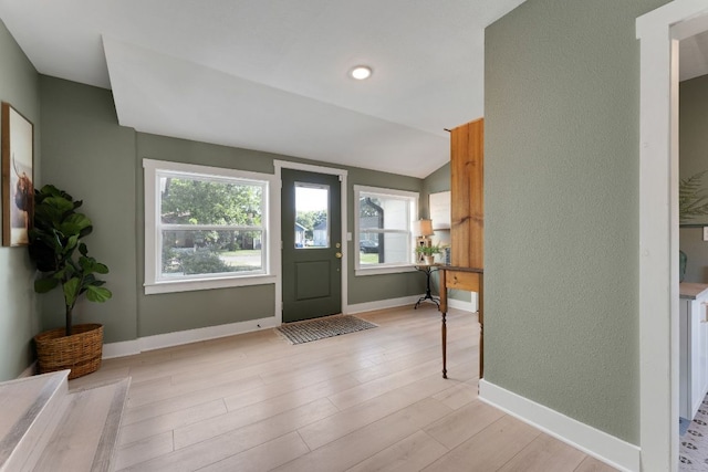 215 Paulus St, Schulenburg, TX 78956 - foyer entrance with light wood-style flooring and vaulted ceiling
