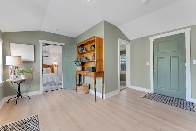 215 Paulus St, Schulenburg, TX 78956 - entryway featuring vaulted ceiling and light wood-style floors