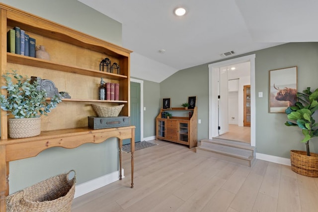 215 Paulus St, Schulenburg, TX 78956 - home office featuring lofted ceiling, wood finished floors, and recessed lighting
