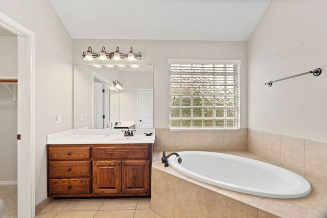 1403 Adam Ave, Burnet, TX 78611 - bathroom featuring vanity, a bath, healthy amount of natural light, and tile patterned flooring