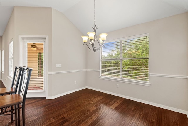 1403 Adam Ave, Burnet, TX 78611 - unfurnished dining area featuring dark wood-style flooring, a chandelier, and vaulted ceiling