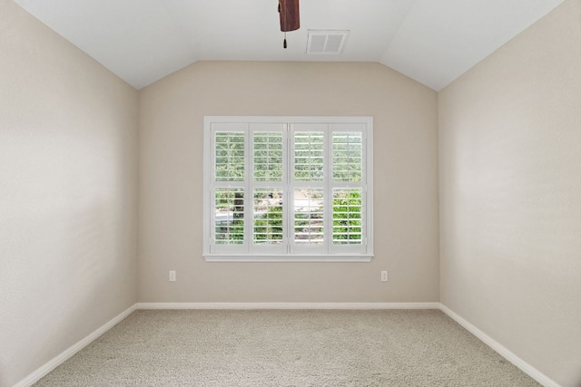 1403 Adam Ave, Burnet, TX 78611 - empty room featuring a ceiling fan, carpet floors, and vaulted ceiling