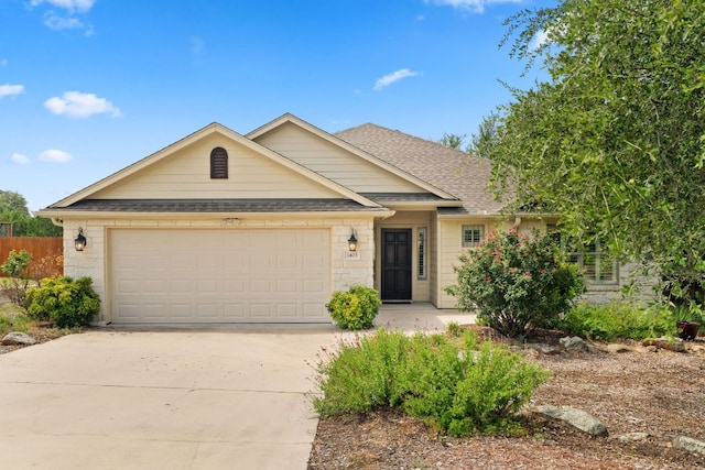 1403 Adam Ave, Burnet, TX 78611 - single story home featuring driveway, a shingled roof, and an attached garage