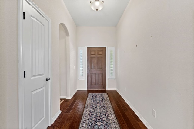 1403 Adam Ave, Burnet, TX 78611 - foyer entrance featuring dark wood-style floors and arched walkways