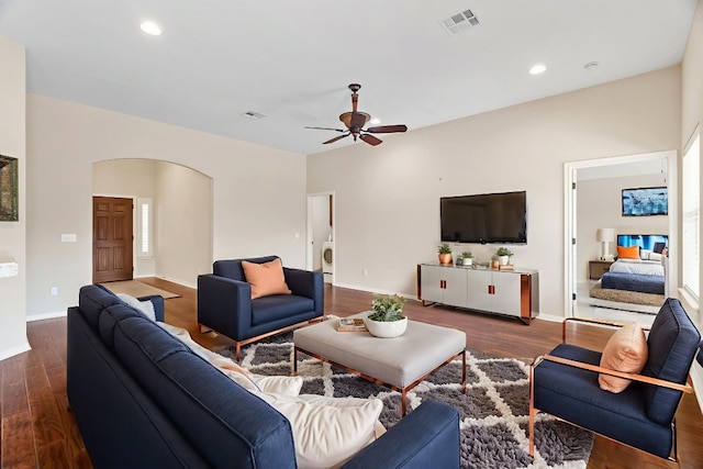 1403 Adam Ave, Burnet, TX 78611 - living room featuring arched walkways, wood finished floors, ceiling fan, washer / dryer, and recessed lighting