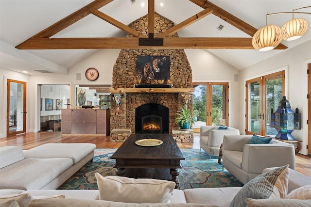601 Crystal Creek Dr, Austin, TX 78746 - living area featuring french doors, wood finished floors, beam ceiling, a fireplace, and high vaulted ceiling