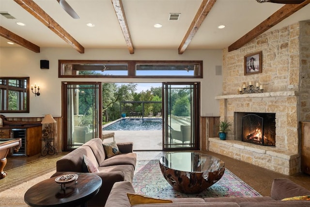 601 Crystal Creek Dr, Austin, TX 78746 - living area with a fireplace, beam ceiling, recessed lighting, and wine cooler