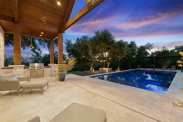 601 Crystal Creek Dr, Austin, TX 78746 - pool at dusk with area for grilling, a patio area, and an outdoor pool