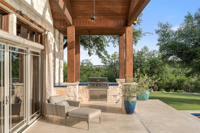 601 Crystal Creek Dr, Austin, TX 78746 - view of patio / terrace with an outdoor kitchen