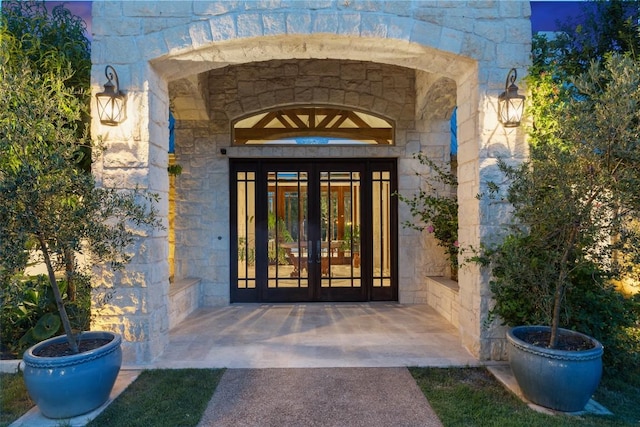 601 Crystal Creek Dr, Austin, TX 78746 - property entrance with stone siding and french doors