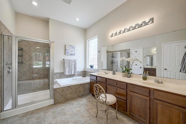 250 Lexington Dr, Austin, TX 78737 - full bath with double vanity, a stall shower, a garden tub, and tile patterned floors