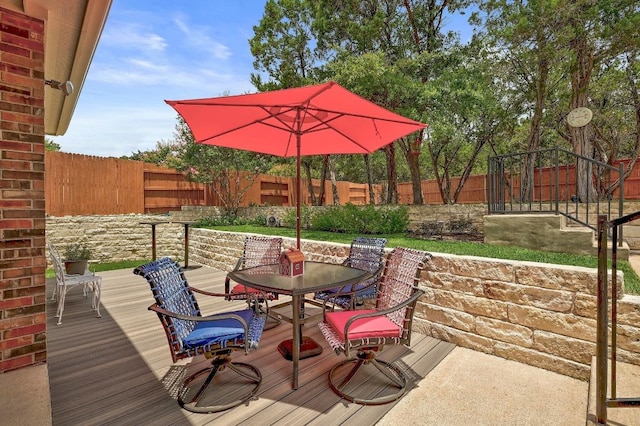 250 Lexington Dr, Austin, TX 78737 - wooden terrace with outdoor dining space and a fenced backyard