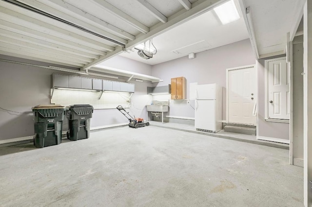 250 Lexington Dr, Austin, TX 78737 - garage featuring freestanding refrigerator and a garage door opener
