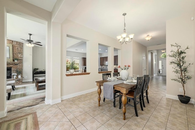 250 Lexington Dr, Austin, TX 78737 - dining space featuring a chandelier, light tile patterned flooring, a fireplace, and a ceiling fan