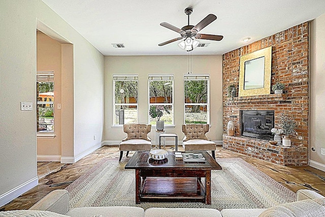 250 Lexington Dr, Austin, TX 78737 - living room featuring a ceiling fan, a fireplace, and wood finished floors