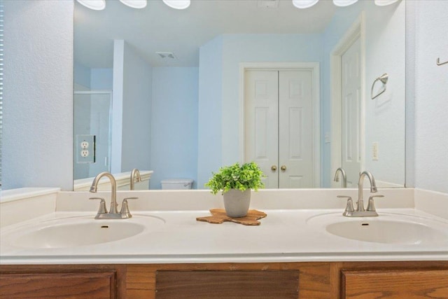 1811 Indian Summer Pass, Round Rock, TX 78665 - full bath with double vanity and a shower with door