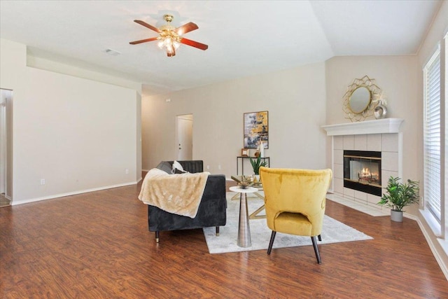 1811 Indian Summer Pass, Round Rock, TX 78665 - living room with wood finished floors, a tile fireplace, ceiling fan, plenty of natural light, and lofted ceiling
