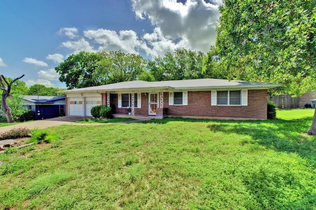 11907 Oak Trl, Austin, TX 78753 - ranch-style house with brick siding, an attached garage, a front yard, and concrete driveway