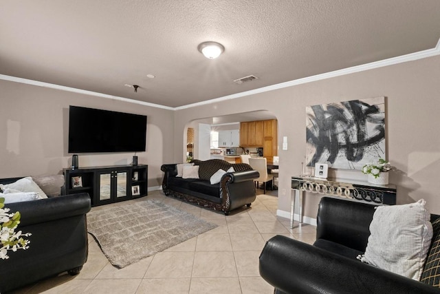 11907 Oak Trl, Austin, TX 78753 - living room with arched walkways, light tile patterned floors, crown molding, and a textured ceiling