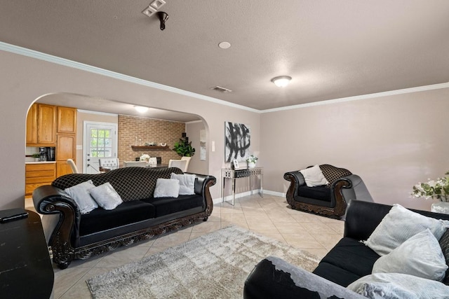 11907 Oak Trl, Austin, TX 78753 - living room with arched walkways, light tile patterned floors, ornamental molding, and a textured ceiling