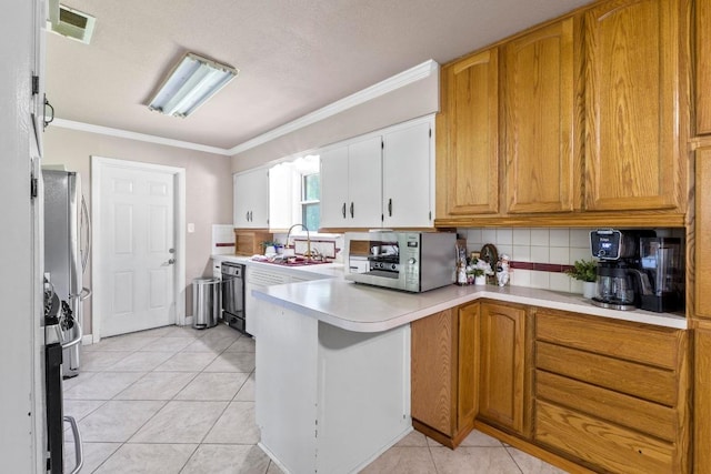11907 Oak Trl, Austin, TX 78753 - kitchen featuring light countertops, tasteful backsplash, a peninsula, crown molding, and light tile patterned floors