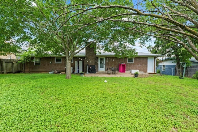 11907 Oak Trl, Austin, TX 78753 - back of house with brick siding, a fenced backyard, and a patio area
