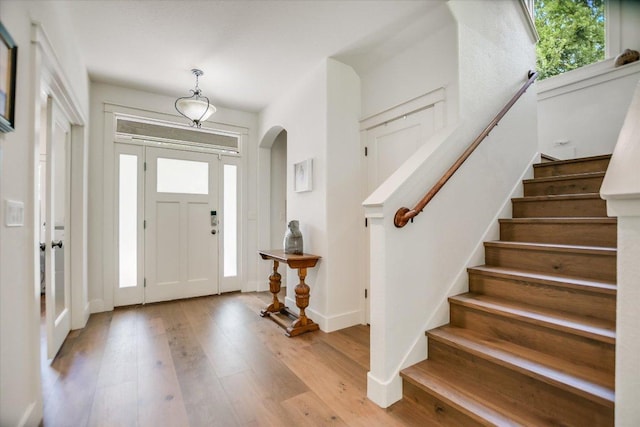 2707 La Mesa Dr, Austin, TX 78704 - entrance foyer featuring stairway, arched walkways, and light wood-style floors