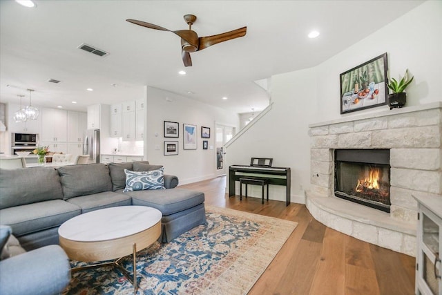2707 La Mesa Dr, Austin, TX 78704 - living area featuring ceiling fan, a fireplace, wood finished floors, and recessed lighting
