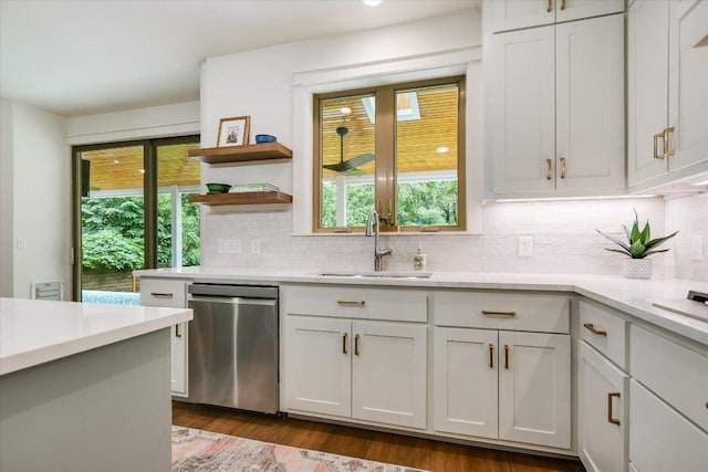 2707 La Mesa Dr, Austin, TX 78704 - kitchen featuring stainless steel dishwasher, light countertops, and decorative backsplash