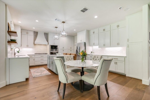 2707 La Mesa Dr, Austin, TX 78704 - dining room featuring light wood-style floors and recessed lighting