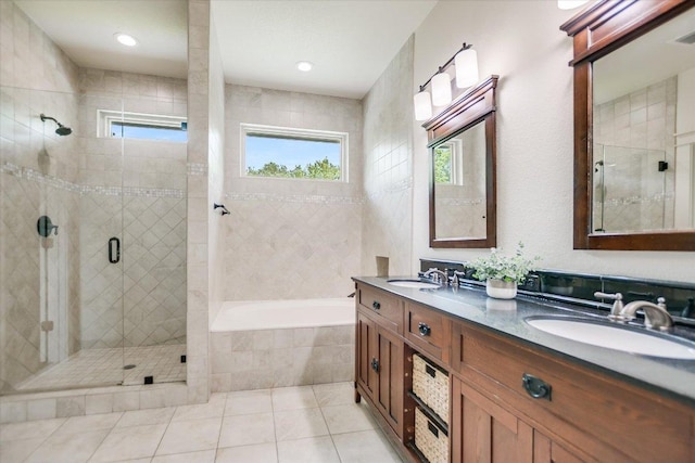 2707 La Mesa Dr, Austin, TX 78704 - full bath with a garden tub, double vanity, a stall shower, and tile patterned floors
