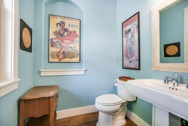 2707 La Mesa Dr, Austin, TX 78704 - bathroom featuring baseboards and wood finished floors