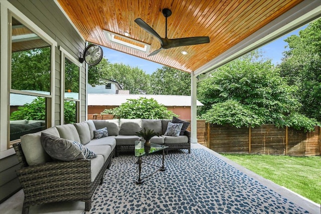 2707 La Mesa Dr, Austin, TX 78704 - fenced backyard with an outdoor hangout area and a ceiling fan