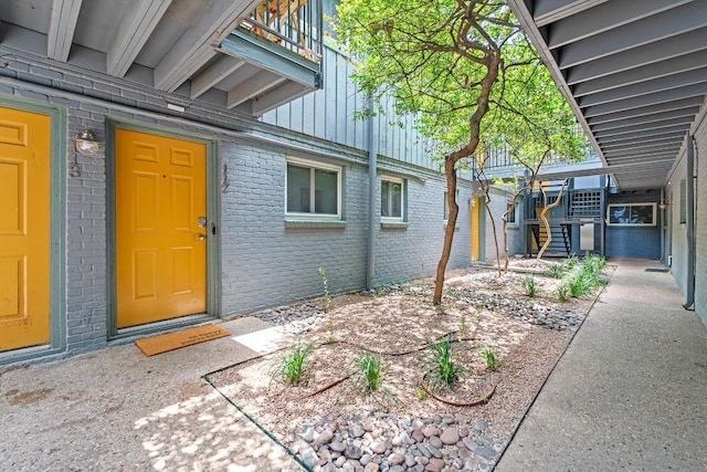 3815 Guadalupe St Unit 112, Austin, TX 78751 - doorway to property with brick siding and board and batten siding