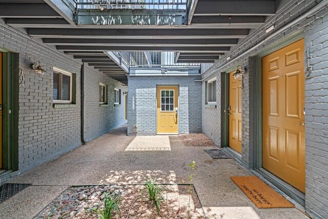 3815 Guadalupe St Unit 112, Austin, TX 78751 - view of exterior entry featuring brick siding