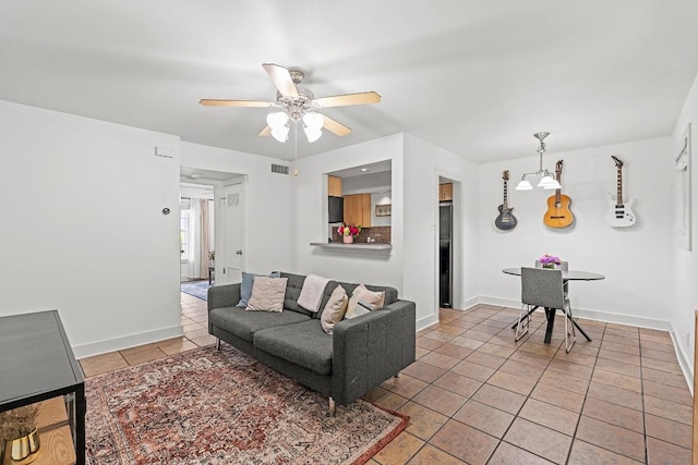 3815 Guadalupe St Unit 112, Austin, TX 78751 - tiled living area with ceiling fan and baseboards