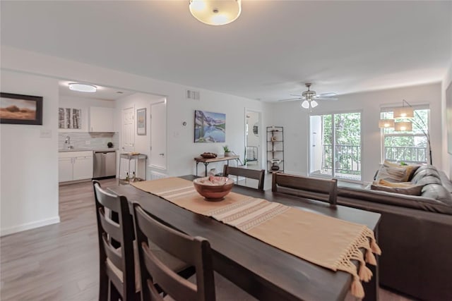 3604 Clawson Rd Unit 204, Austin, TX 78704 - dining room featuring light wood-style flooring and ceiling fan